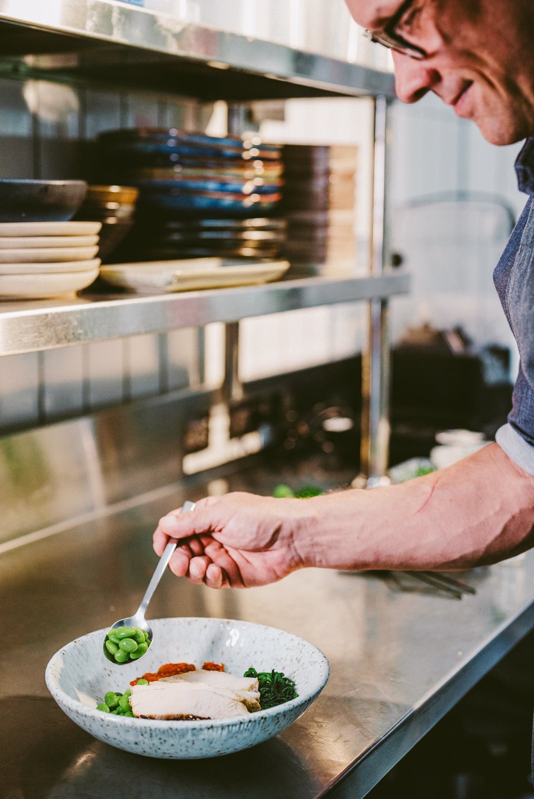 Slice Wellbeing chef preparing a fresh plate